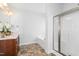 Bright bathroom featuring a double vanity, soaking tub, and glass-enclosed shower at 93 Kinsale Ct, Garner, NC 27529