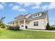 Exterior view of the community clubhouse with a long covered porch and well-manicured landscaping at 93 Kinsale Ct, Garner, NC 27529