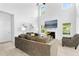 Bright living room featuring high ceilings, a fireplace, and comfortable seating at 93 Kinsale Ct, Garner, NC 27529