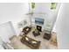 Open concept living room with fireplace, large TV, lots of light, and comfortable seating at 93 Kinsale Ct, Garner, NC 27529