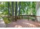 Relax on the spacious deck overlooking the lush, tree-filled backyard and above-ground pool at 1008 Alderleaf Dr, Fuquay Varina, NC 27526