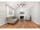 Inviting living room with vaulted ceilings, fireplace, and wood laminate flooring at 1008 Alderleaf Dr, Fuquay Varina, NC 27526