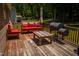 Relaxing wooden deck with outdoor seating and a barbecue grill at 102 Bluegrass Dr, Oxford, NC 27565