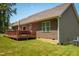 A back exterior view of a home with a wooden deck and siding at 102 Bluegrass Dr, Oxford, NC 27565