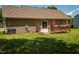 Back exterior view of house showing deck and trash cans at 102 Bluegrass Dr, Oxford, NC 27565