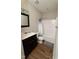 Bathroom featuring a vanity, toilet, and shower with modern fixtures and wood look flooring at 102 Bluegrass Dr, Oxford, NC 27565