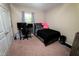 Bedroom with a black bed, computer setup, and a window with natural light at 102 Bluegrass Dr, Oxford, NC 27565