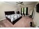 A bedroom featuring neutral walls, a ceiling fan, a carpet, and a platform bed frame at 102 Bluegrass Dr, Oxford, NC 27565