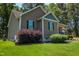 Single-story home featuring manicured front yard and landscaping at 102 Bluegrass Dr, Oxford, NC 27565