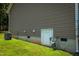 Exterior view of home showing access door and utilities at 102 Bluegrass Dr, Oxford, NC 27565