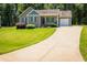 Charming single-story home with a well-manicured lawn and an attached one-car garage at 102 Bluegrass Dr, Oxford, NC 27565