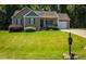 A charming single-story home with a well-manicured front lawn at 102 Bluegrass Dr, Oxford, NC 27565