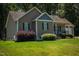 Charming single-story home with well maintained lawn and landscaping at 102 Bluegrass Dr, Oxford, NC 27565