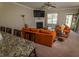 Cozy living room features a fireplace, ceiling fan, and comfortable seating arrangement at 102 Bluegrass Dr, Oxford, NC 27565