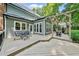 Backyard deck featuring a table, chairs, and a pergola perfect for outdoor dining and relaxation at 1030 W Sterlington Pl, Apex, NC 27502