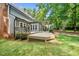Spacious backyard deck featuring a pergola and an inviting outdoor seating area overlooking the lush yard at 1030 W Sterlington Pl, Apex, NC 27502