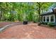 Outdoor patio with brick pavers, stone retaining wall, and a backyard view at 1030 W Sterlington Pl, Apex, NC 27502