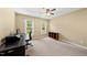 Bedroom with a work-study station, neutral paint, and a window letting in natural light at 1030 W Sterlington Pl, Apex, NC 27502