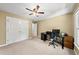 Bedroom with a ceiling fan, a full-size workstation, and carpeted floors at 1030 W Sterlington Pl, Apex, NC 27502