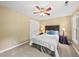 Bedroom with twin bedside lamps, neutral walls, and carpet flooring at 1030 W Sterlington Pl, Apex, NC 27502