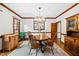Elegant dining room featuring wood trim, a round table, and a light fixture at 1030 W Sterlington Pl, Apex, NC 27502