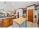 Kitchen with an eat-in bar, cabinetry, and access to other living spaces at 1030 W Sterlington Pl, Apex, NC 27502