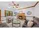 Bright living room boasts a fireplace, vaulted ceilings, and abundant natural light from a skylight and large windows at 1030 W Sterlington Pl, Apex, NC 27502