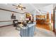 Comfortable living room with neutral decor, a view to the kitchen and a seamless transition for entertaining at 1030 W Sterlington Pl, Apex, NC 27502