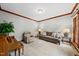 Relaxing living room with comfortable seating, neutral tones, and natural light at 1030 W Sterlington Pl, Apex, NC 27502