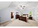 Spacious main bedroom with large windows, a ceiling fan, and an adjoining ensuite bathroom for convenience at 1030 W Sterlington Pl, Apex, NC 27502