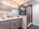 Modern bathroom with marble countertops, double sinks, and a glass enclosed marble shower at 104 Warley Cir, Cary, NC 27513
