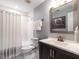 Clean bathroom features a shower and tub combination, modern fixtures, and a framed print at 104 Warley Cir, Cary, NC 27513