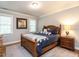 Charming bedroom features hardwood floors, a bed with throw pillows, and natural light from two windows at 104 Warley Cir, Cary, NC 27513