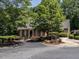 A brick clubhouse with a landscaped entrance, offering a welcoming community space at 104 Warley Cir, Cary, NC 27513