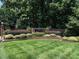 Brick community sign, featuring manicured landscaping in a serene setting at 104 Warley Cir, Cary, NC 27513