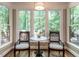 Bright dining area with backyard views and seating for two at 104 Warley Cir, Cary, NC 27513