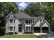 Beautiful gray brick home with a manicured lawn and two-car garage at 104 Warley Cir, Cary, NC 27513