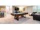 Entertainment space with a pool table, seating area, wet bar, and carpet floors at 104 Warley Cir, Cary, NC 27513
