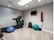 Home gym with workout equipment, including a treadmill and free weights, for convenient exercise at 104 Warley Cir, Cary, NC 27513