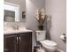 Stylish half bathroom featuring modern fixtures and a sleek vanity at 104 Warley Cir, Cary, NC 27513