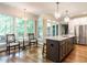 Eat-in kitchen area with stainless steel appliances and light filled windows overlooking backyard at 104 Warley Cir, Cary, NC 27513