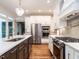 Updated kitchen featuring stainless steel appliances and custom white cabinetry at 104 Warley Cir, Cary, NC 27513