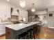 Bright open kitchen with a large island, stainless steel appliances, and bar stool seating at 104 Warley Cir, Cary, NC 27513