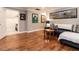 Inviting living room with hardwood floors, comfortable seating, and framed sports memorabilia on the walls at 104 Warley Cir, Cary, NC 27513