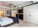 A luxurious main bedroom features a ceiling fan, a TV above the dresser, and double doors to the closet at 104 Warley Cir, Cary, NC 27513