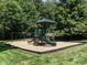 Community playground with slides and swings, providing a fun and safe play area at 104 Warley Cir, Cary, NC 27513
