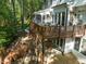 Spacious outdoor entertaining space with multilevel decks, stairs, and scenic views at 104 Warley Cir, Cary, NC 27513