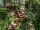Stunning back exterior featuring expansive decks and stairs leading to the wooded backyard at 104 Warley Cir, Cary, NC 27513