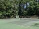 Well-maintained community tennis court surrounded by trees, ideal for sports enthusiasts at 104 Warley Cir, Cary, NC 27513