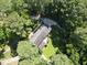 Aerial view of a home with a long driveway surrounded by mature trees at 10625 Soma Ct, Raleigh, NC 27613